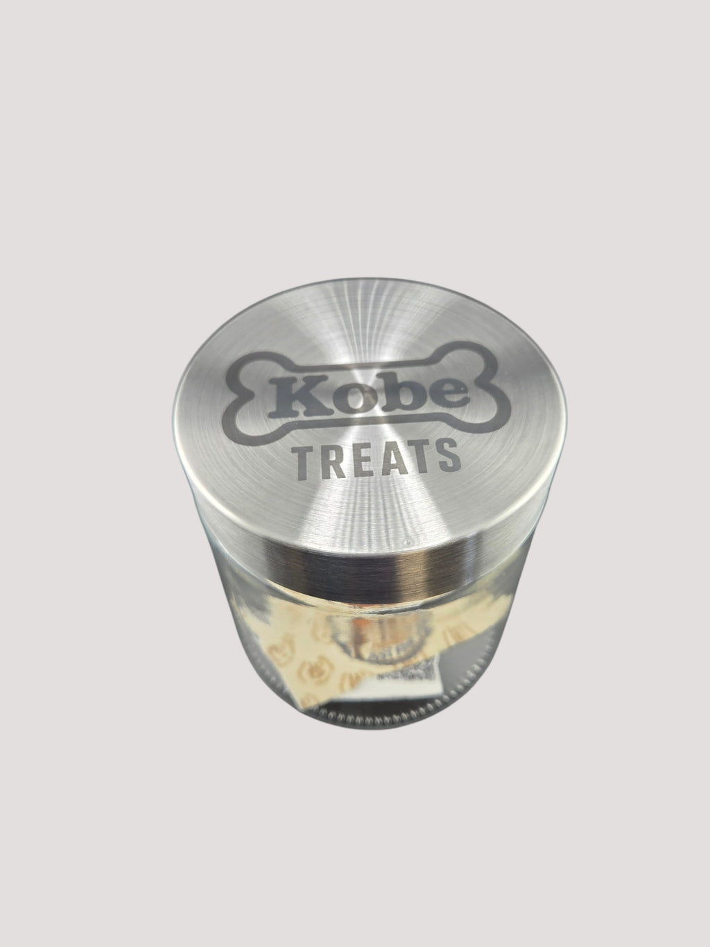 L & P Golden goods clear glass storage jar with a stainless steel lid laser engraved with Kobe Treats bone design