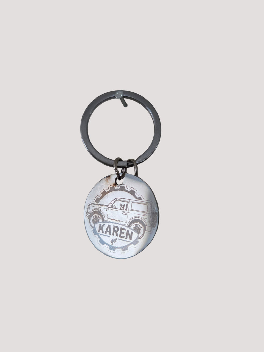 L & P Golden goods custom round stainless steel keychain with laser-engraved off-road vehicle design and name Karen